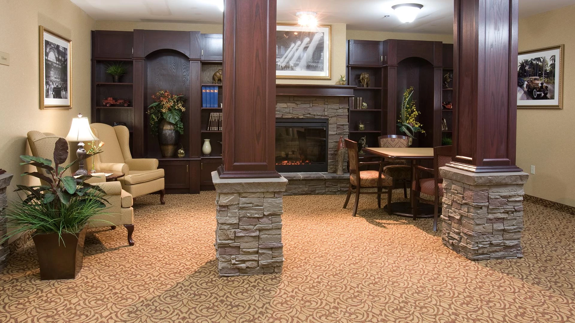 Peaceful library with fireplace at Summerwood village retirement home