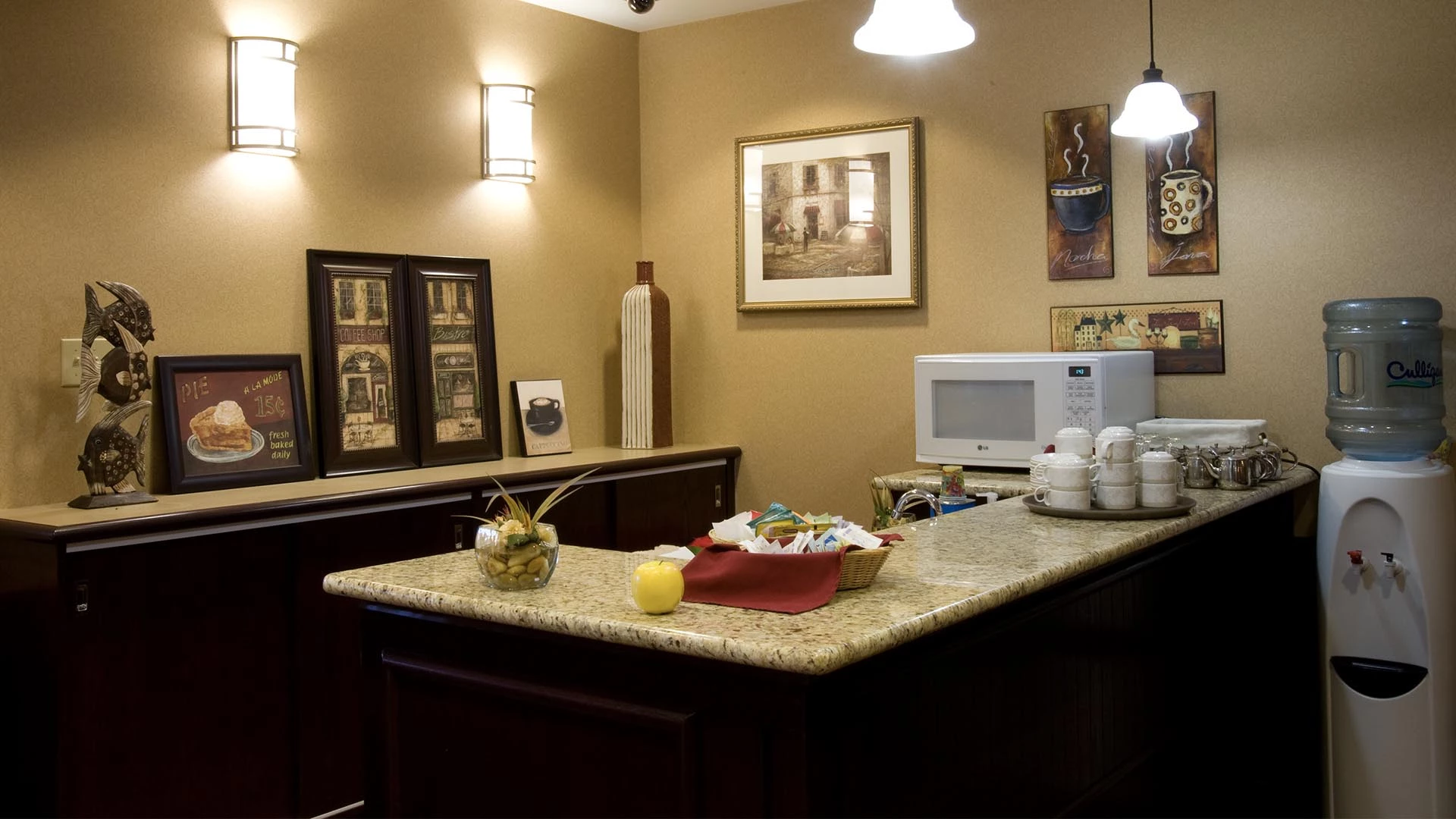 Main floor bistro coffee lounge with water cooler and microwave at Summerwood Village retirement home